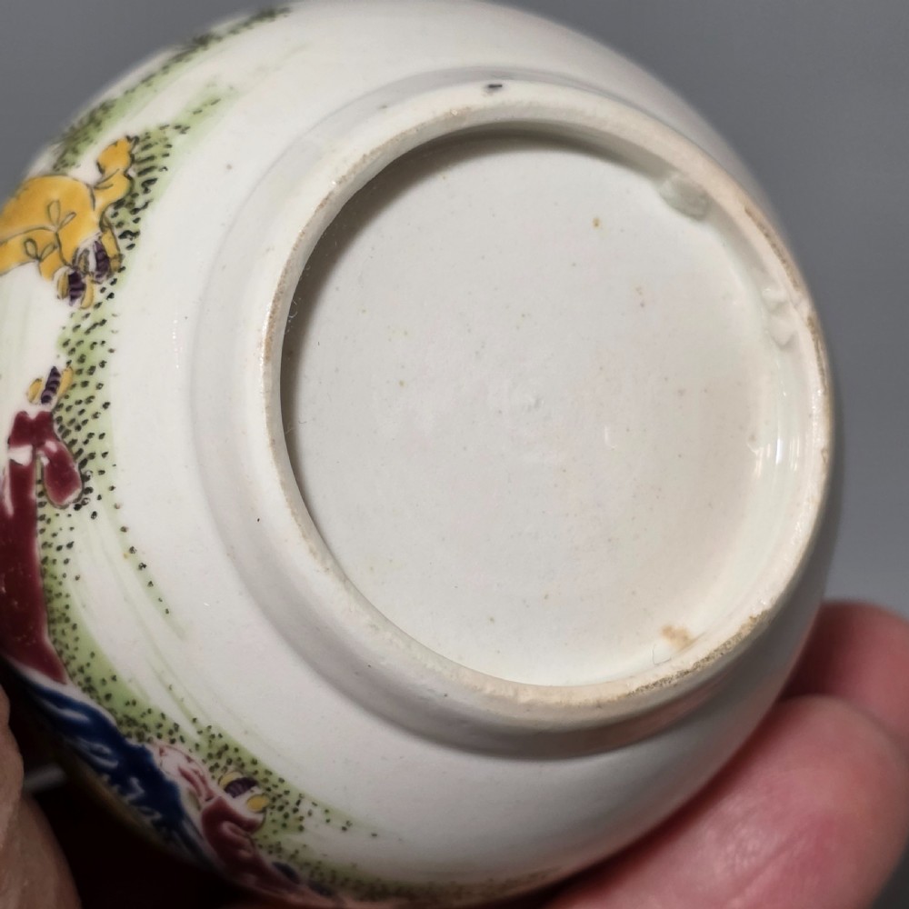 An 18th-century Worcester porcelain sparrow beak cream jug of baluster form, hand-painted with polychrome enamel figures and foliage. View X