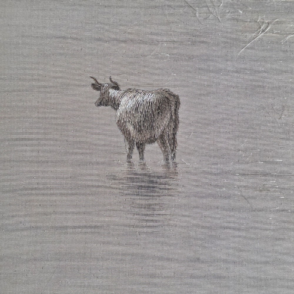A framed Chinese silk embroidery panel depicting cattle standing in water in front of a mountainous background, presented in a wide oak frame. View XI