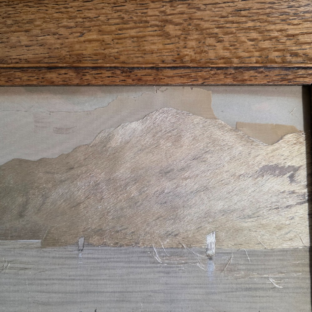 A framed Chinese silk embroidery panel depicting cattle standing in water in front of a mountainous background, presented in a wide oak frame. View XV