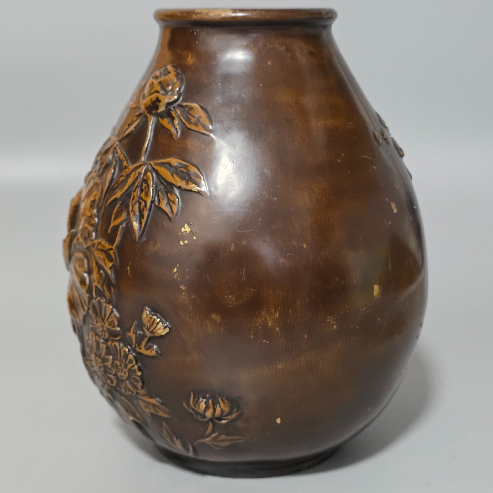 A dark brown patinated bronze vase featuring raised high-relief floral carvings of large peonies and chrysanthemums. View II