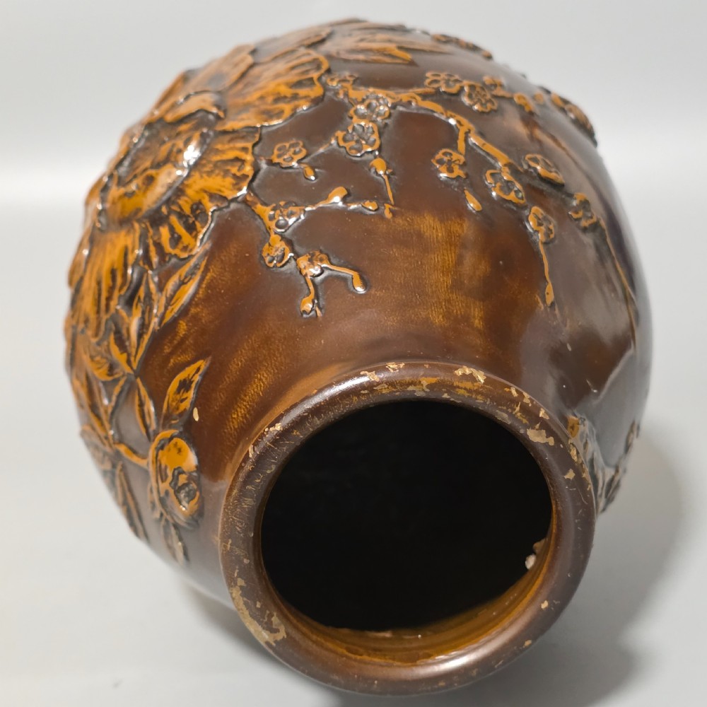 A dark brown patinated bronze vase featuring raised high-relief floral carvings of large peonies and chrysanthemums. View VII