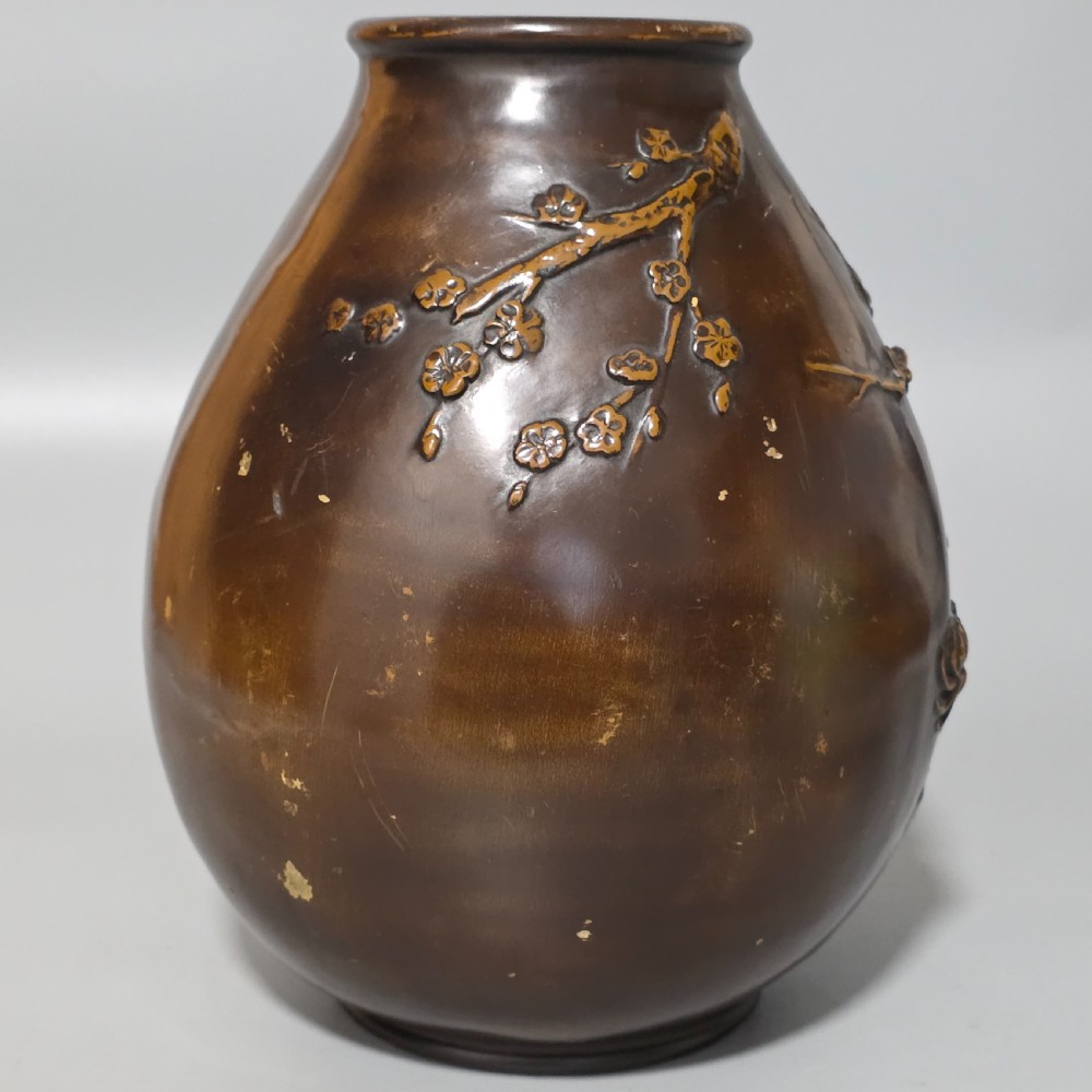 A dark brown patinated bronze vase featuring raised high-relief floral carvings of large peonies and chrysanthemums. View VIII