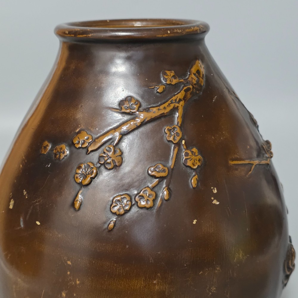A dark brown patinated bronze vase featuring raised high-relief floral carvings of large peonies and chrysanthemums. View IX