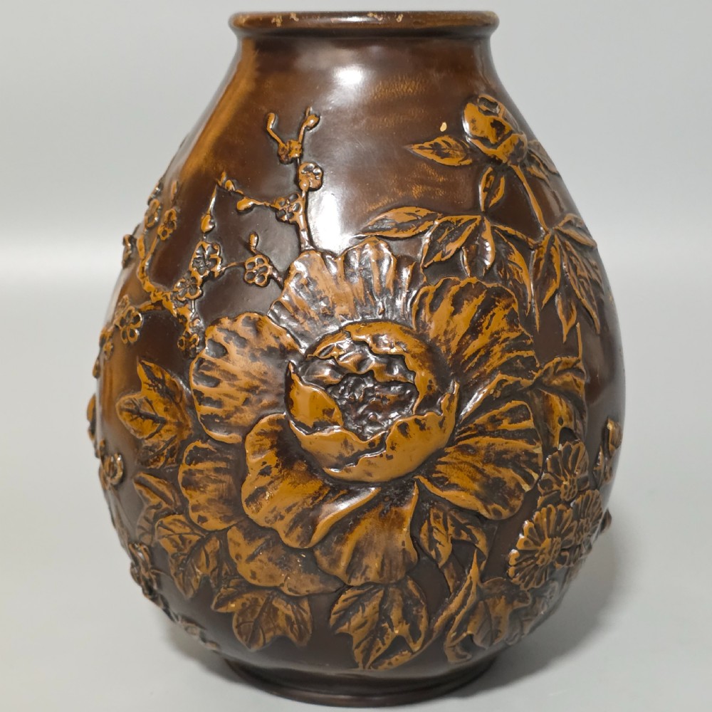 A dark brown patinated bronze vase featuring raised high-relief floral carvings of large peonies and chrysanthemums. View XI