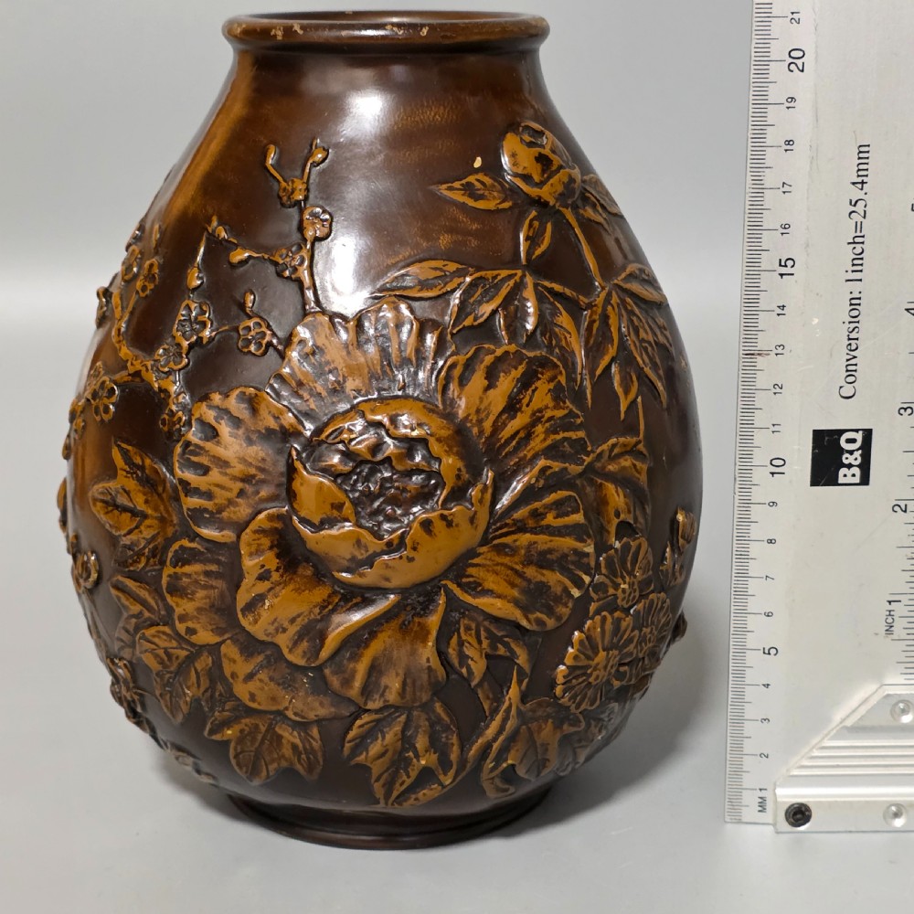 A dark brown patinated bronze vase featuring raised high-relief floral carvings of large peonies and chrysanthemums. View XIV