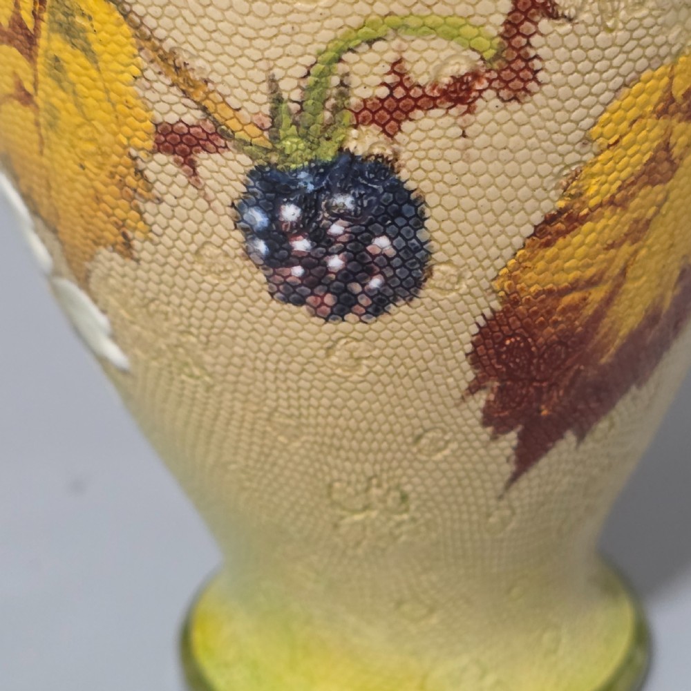 A baluster-shaped Doulton Lambeth ceramic vase featuring a textured lace-patterned buff background painted with botanical autumn leaves and blackberries, finished with a bright turquoise interior rim. View XV