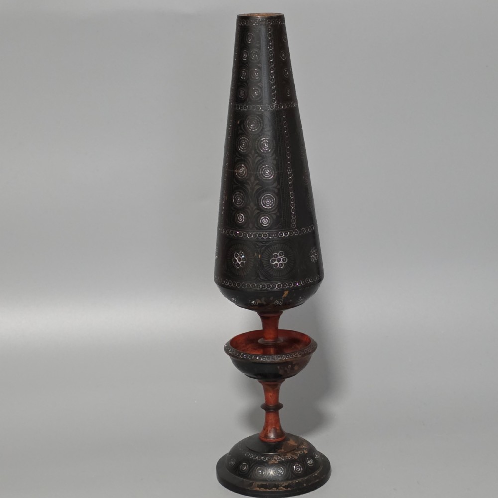 A tall 19th-century lacquered tapering vase with intricate incised geometric motifs on a turned pedestal stem. View VII