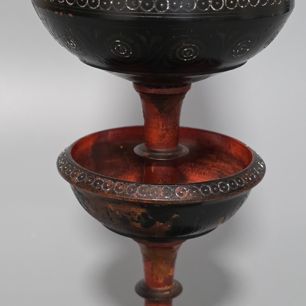 A tall 19th-century lacquered tapering vase with intricate incised geometric motifs on a turned pedestal stem. View IX
