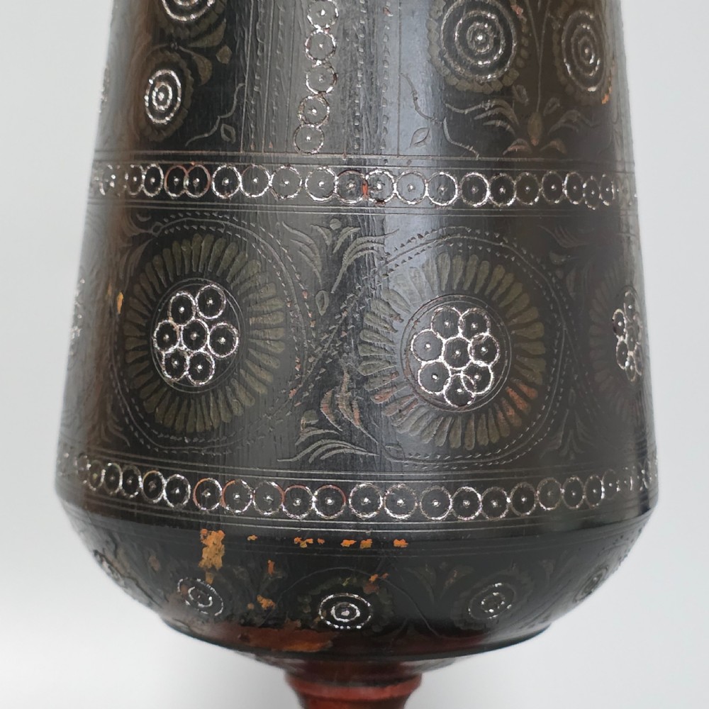 A tall 19th-century lacquered tapering vase with intricate incised geometric motifs on a turned pedestal stem. View X