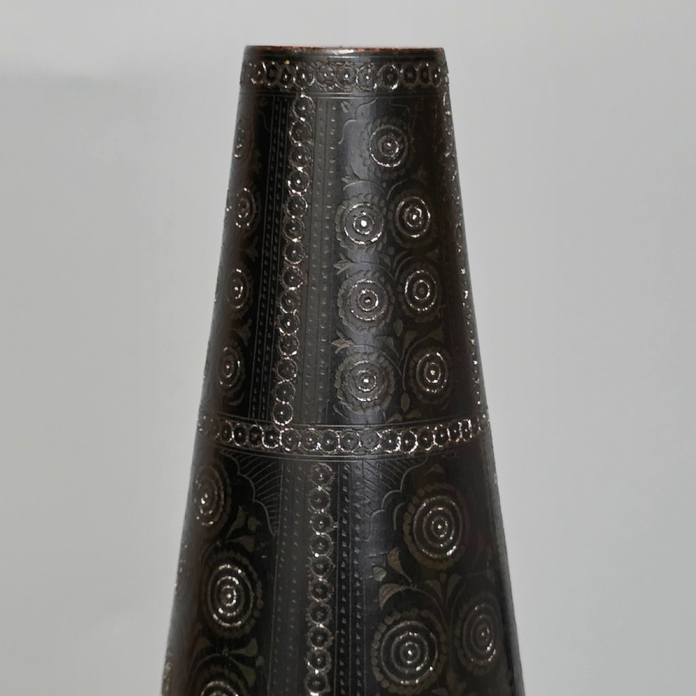 A tall 19th-century lacquered tapering vase with intricate incised geometric motifs on a turned pedestal stem. View XV