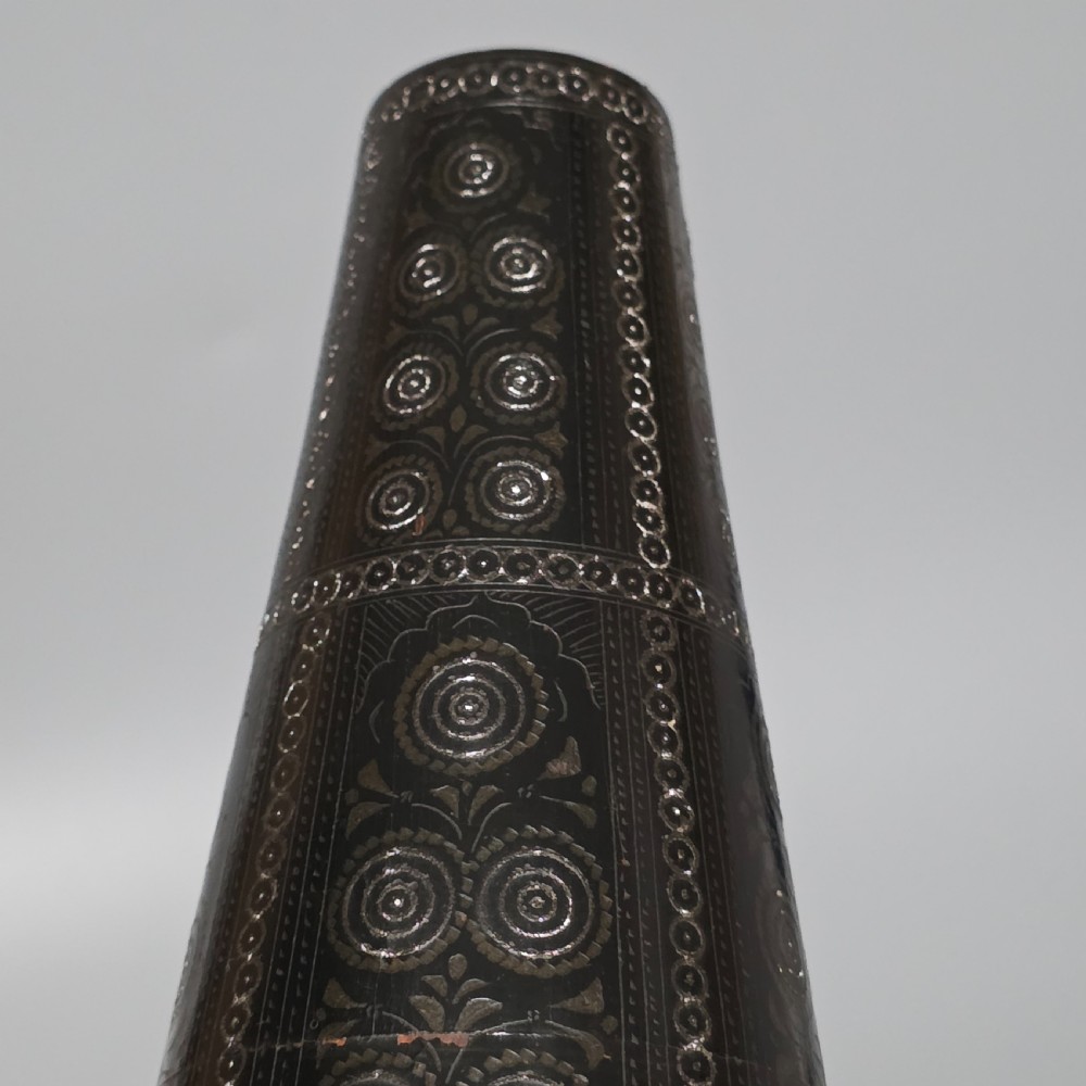 A tall 19th-century lacquered tapering vase with intricate incised geometric motifs on a turned pedestal stem. View XVII