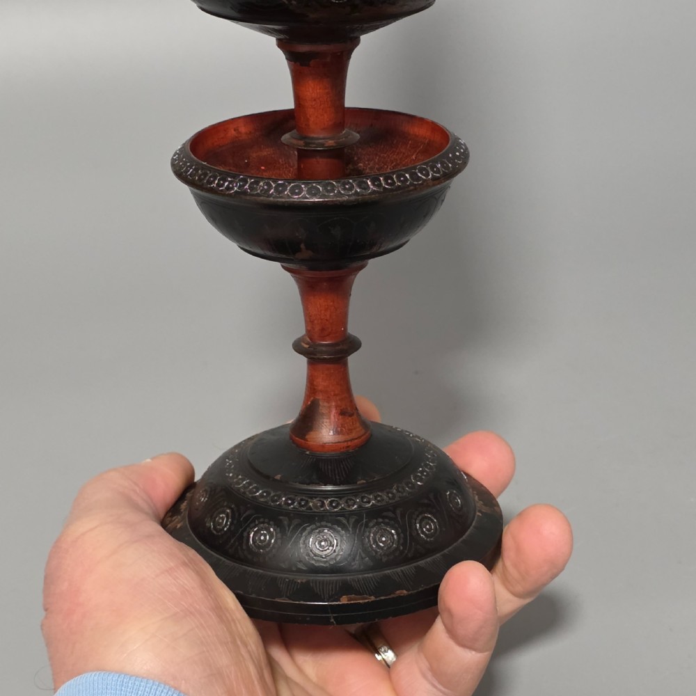 A tall 19th-century lacquered tapering vase with intricate incised geometric motifs on a turned pedestal stem. View XVIII
