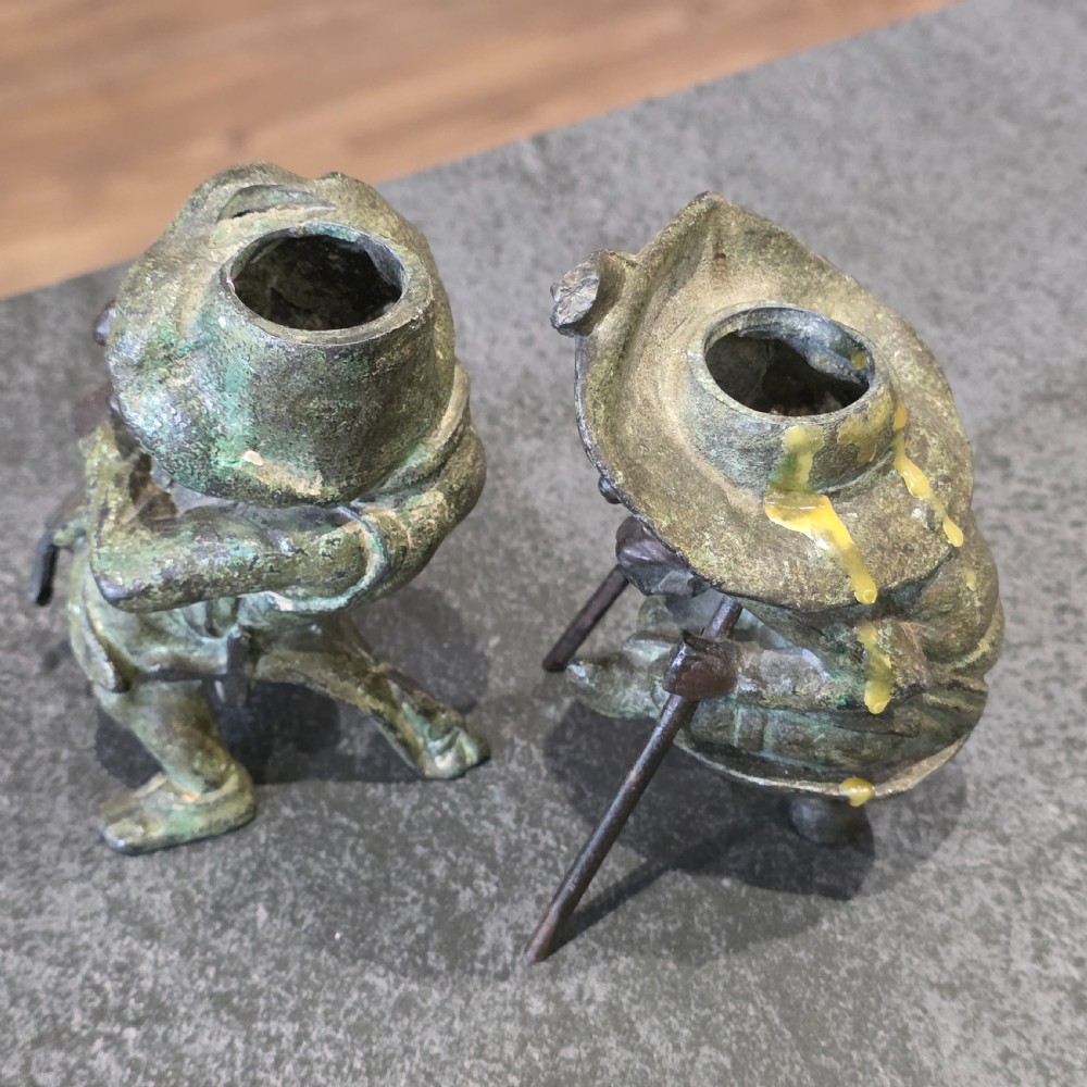 A pair of early twentieth-century French patinated bronze candle holders cast in the form of grotesque satirical caricature figures. View IV