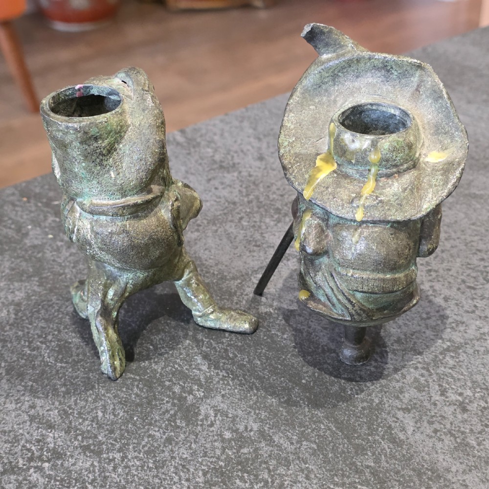 A pair of early twentieth-century French patinated bronze candle holders cast in the form of grotesque satirical caricature figures. View V