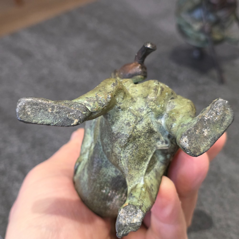 A pair of early twentieth-century French patinated bronze candle holders cast in the form of grotesque satirical caricature figures. View XIV