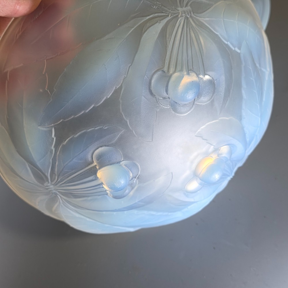 A pair of round 1930s French opalescent glass bowls featuring a moulded cherry and leaf design. View V