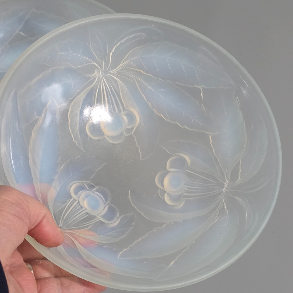 A pair of round 1930s French opalescent glass bowls featuring a moulded cherry and leaf design. View VII