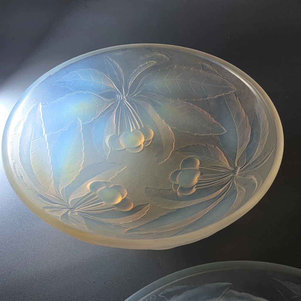 A pair of round 1930s French opalescent glass bowls featuring a moulded cherry and leaf design. View VIII