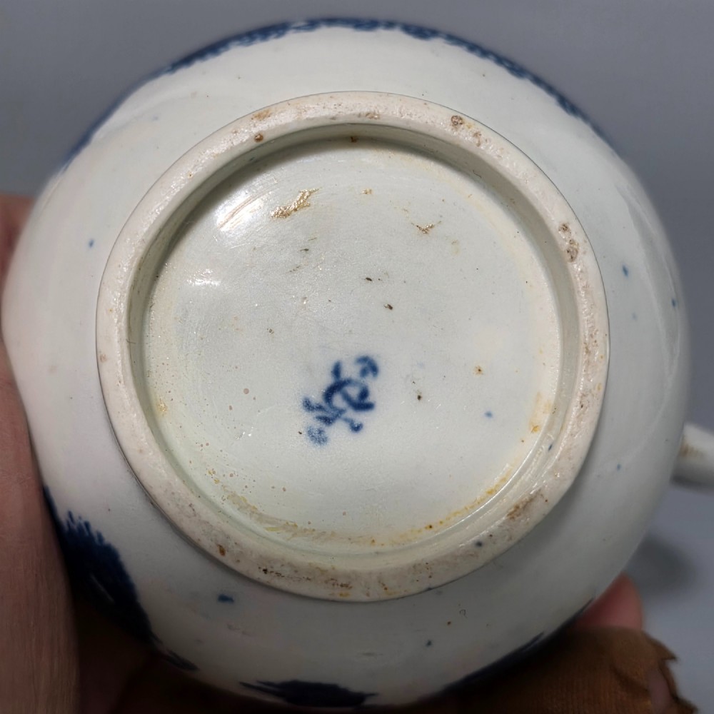 An 18th-century Worcester First Period soft-paste porcelain sparrow beak jug with cover, featuring a blue and white chinoiserie pattern and gilded rims. View VIII