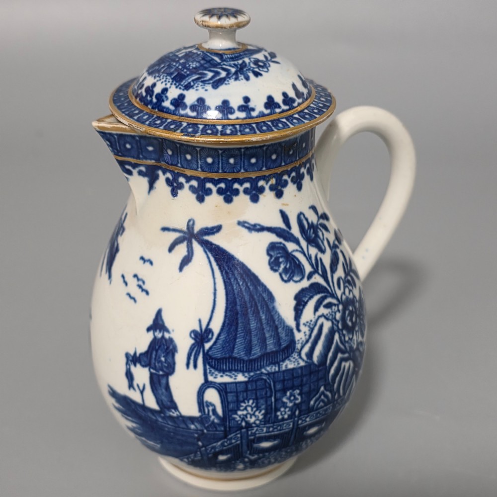 An 18th-century Worcester First Period soft-paste porcelain sparrow beak jug with cover, featuring a blue and white chinoiserie pattern and gilded rims. View XII