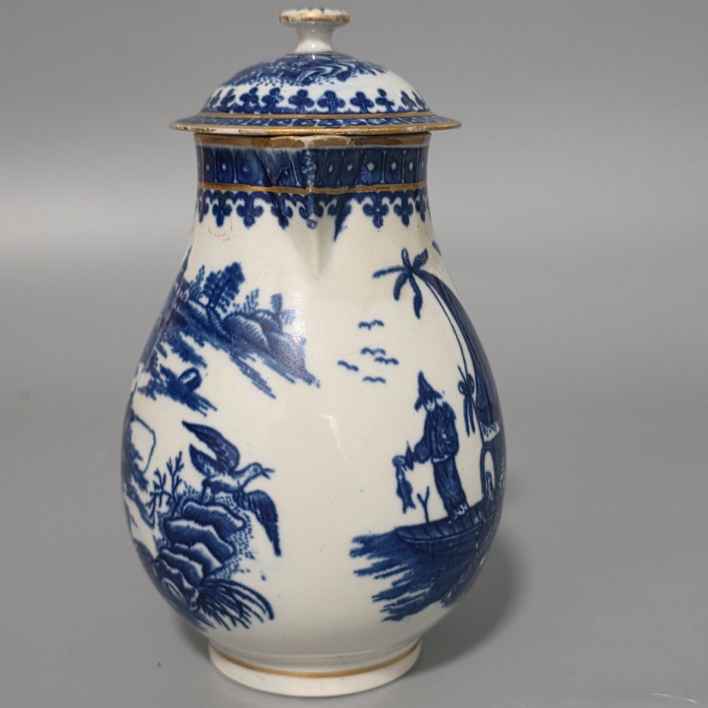 An 18th-century Worcester First Period soft-paste porcelain sparrow beak jug with cover, featuring a blue and white chinoiserie pattern and gilded rims. View XIII
