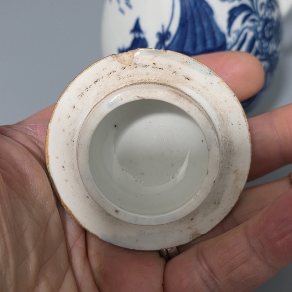 An 18th-century Worcester First Period soft-paste porcelain sparrow beak jug with cover, featuring a blue and white chinoiserie pattern and gilded rims. View XIV