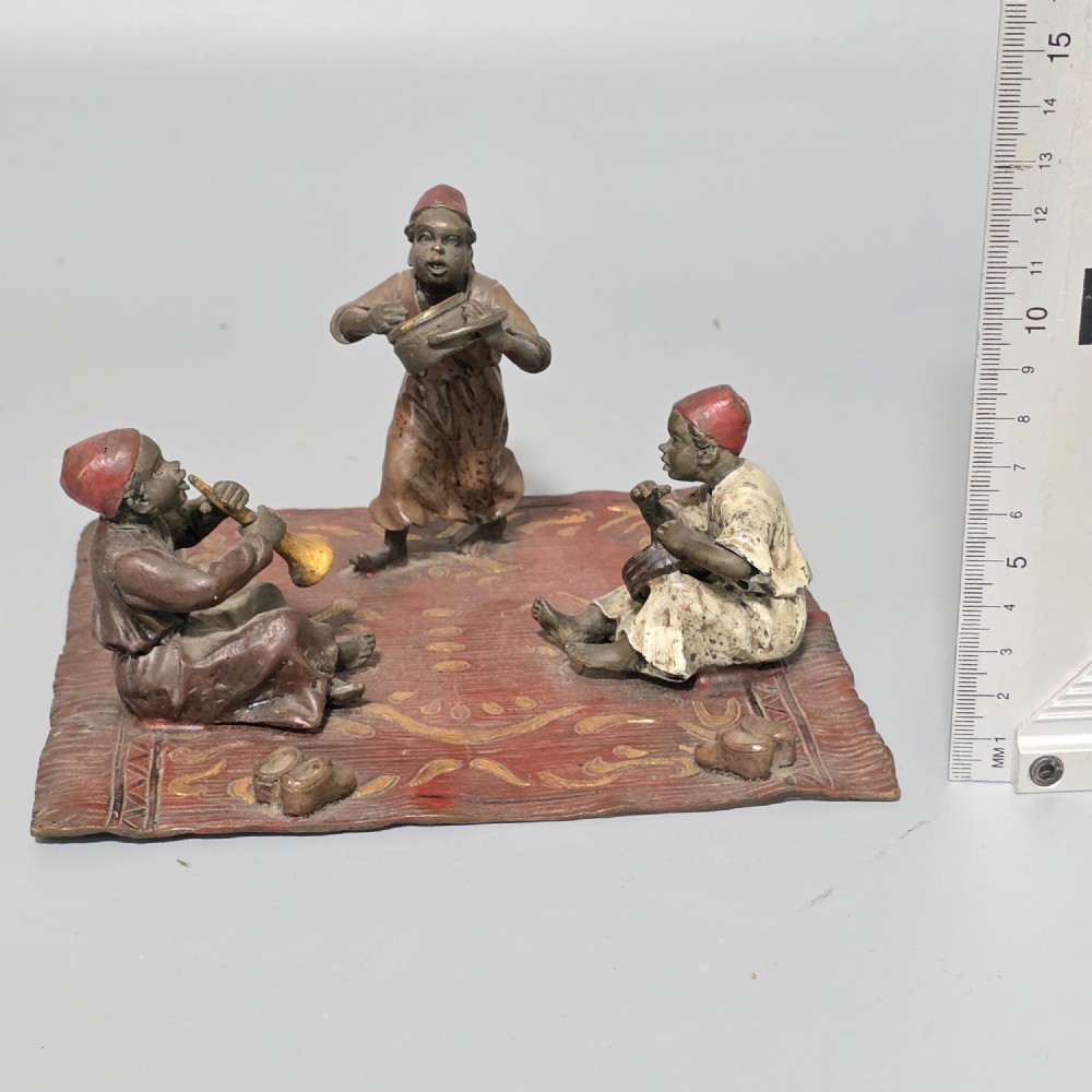 Franz Bergman (Austrian, 1861-1936) An Orientalist cold painted bronze group depicting three musicians on a rug Stamped 'Namgreb and B' and numbered '7813' View III