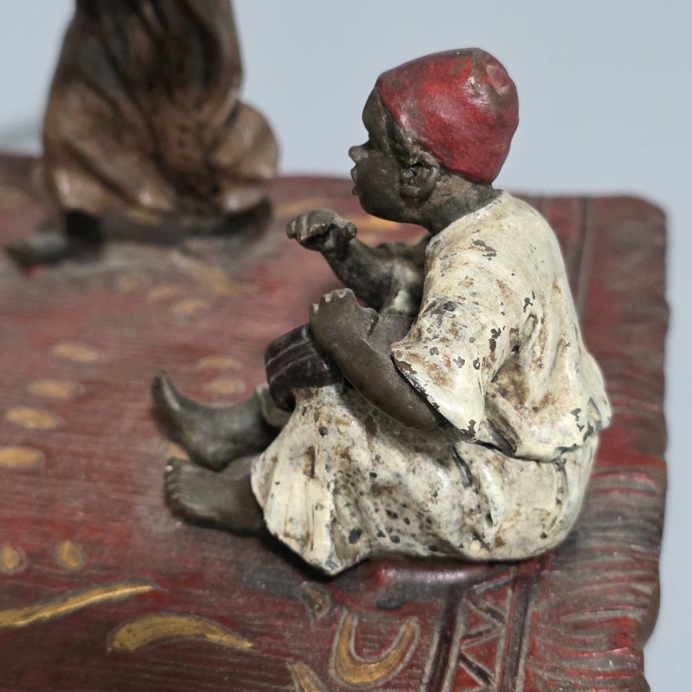 Franz Bergman (Austrian, 1861-1936) An Orientalist cold painted bronze group depicting three musicians on a rug Stamped 'Namgreb and B' and numbered '7813' View IV