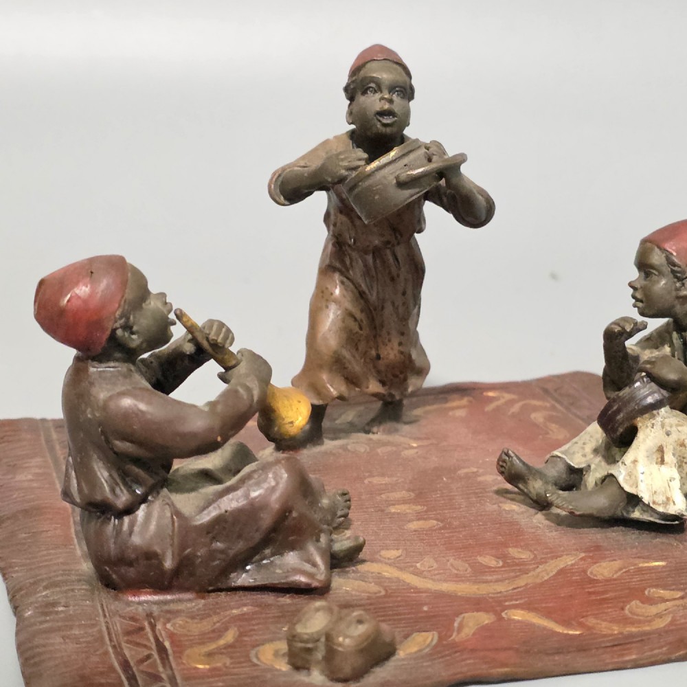 Franz Bergman (Austrian, 1861-1936) An Orientalist cold painted bronze group depicting three musicians on a rug Stamped 'Namgreb and B' and numbered '7813' View V