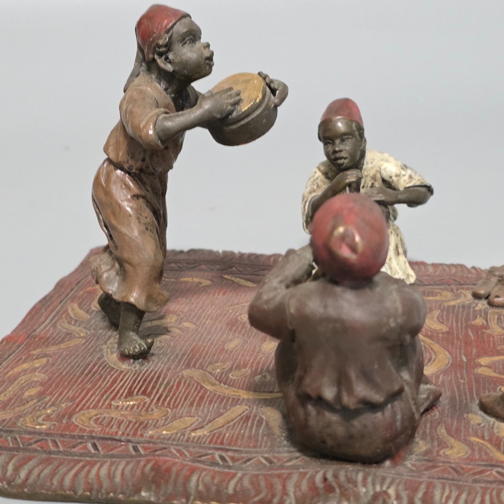 Franz Bergman (Austrian, 1861-1936) An Orientalist cold painted bronze group depicting three musicians on a rug Stamped 'Namgreb and B' and numbered '7813' View VI