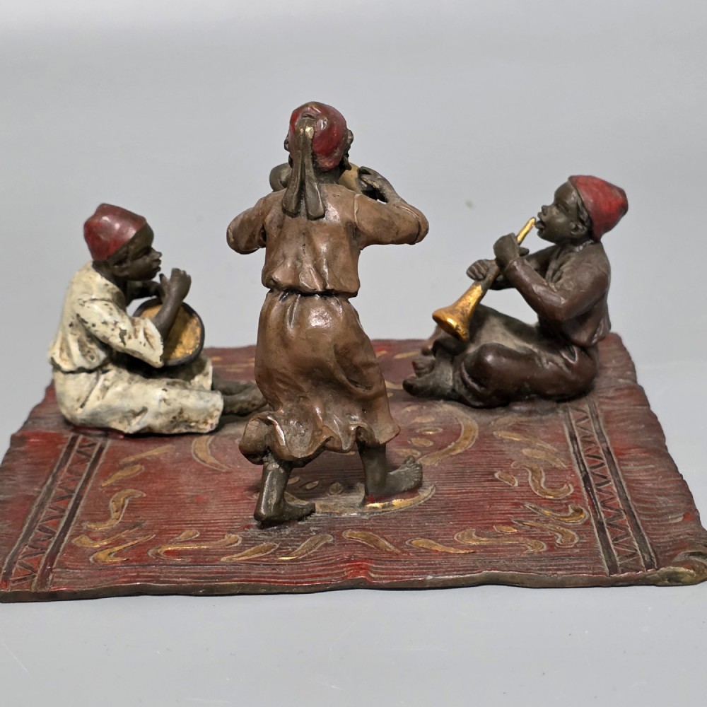 Franz Bergman (Austrian, 1861-1936) An Orientalist cold painted bronze group depicting three musicians on a rug Stamped 'Namgreb and B' and numbered '7813' View X