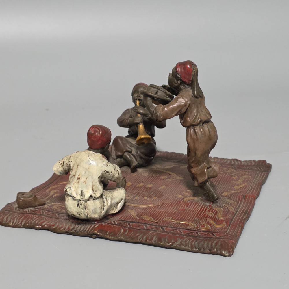 Franz Bergman (Austrian, 1861-1936) An Orientalist cold painted bronze group depicting three musicians on a rug Stamped 'Namgreb and B' and numbered '7813' View XII