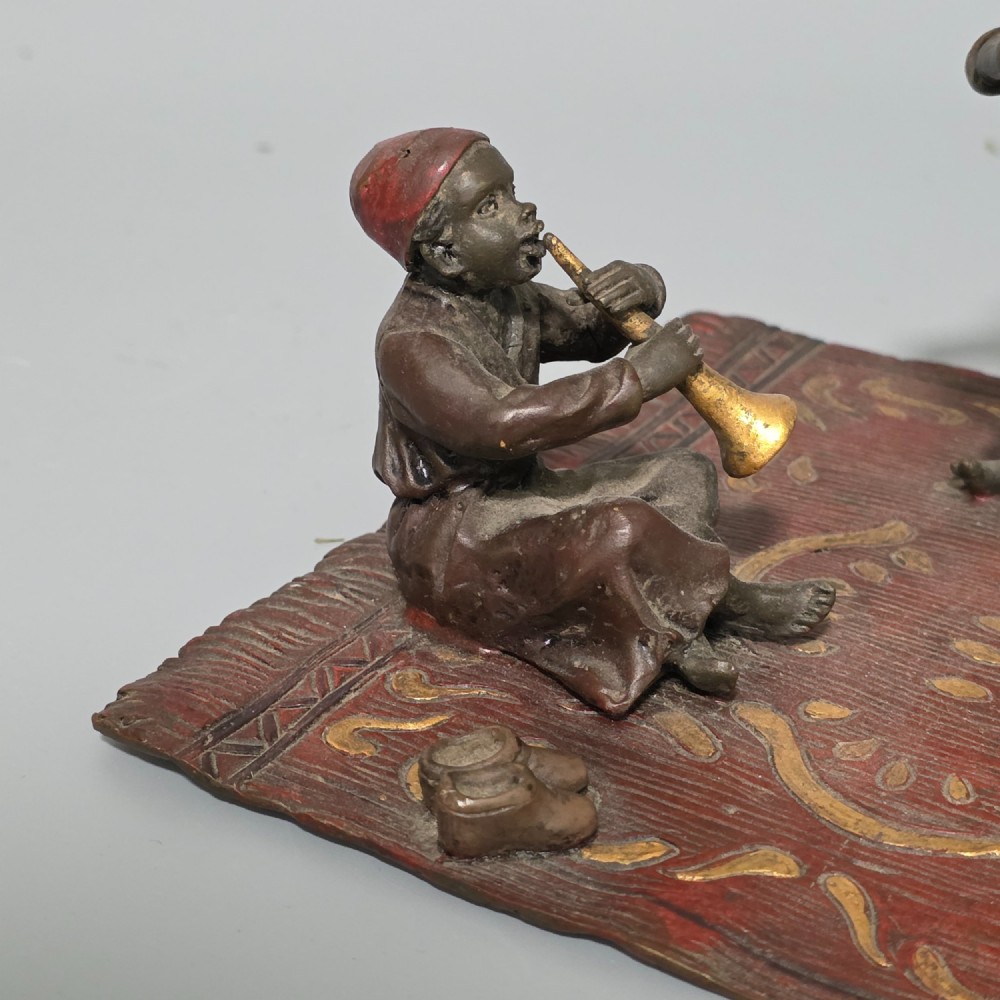 Franz Bergman (Austrian, 1861-1936) An Orientalist cold painted bronze group depicting three musicians on a rug Stamped 'Namgreb and B' and numbered '7813' View XIV