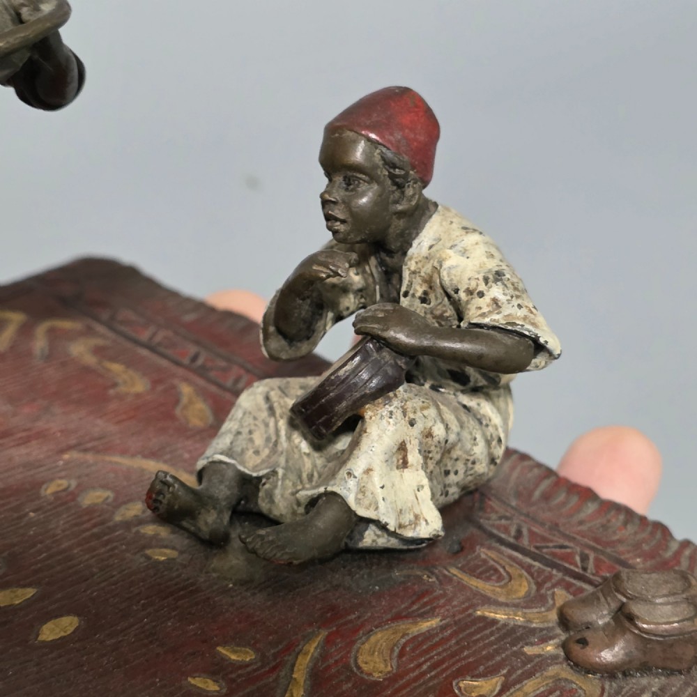 Franz Bergman (Austrian, 1861-1936) An Orientalist cold painted bronze group depicting three musicians on a rug Stamped 'Namgreb and B' and numbered '7813' View XV