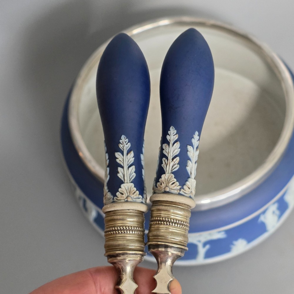 A Victorian Wedgwood blue jasperware salad bowl with a silver-plated rim, decorated with white neoclassical relief figures, complete with matching blue and silver servers. View II