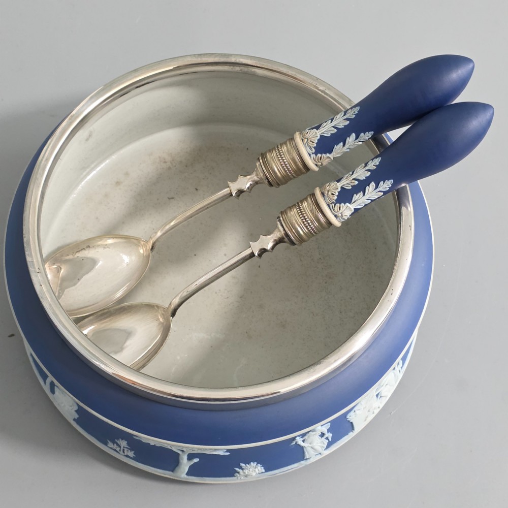 A Victorian Wedgwood blue jasperware salad bowl with a silver-plated rim, decorated with white neoclassical relief figures, complete with matching blue and silver servers. View VII