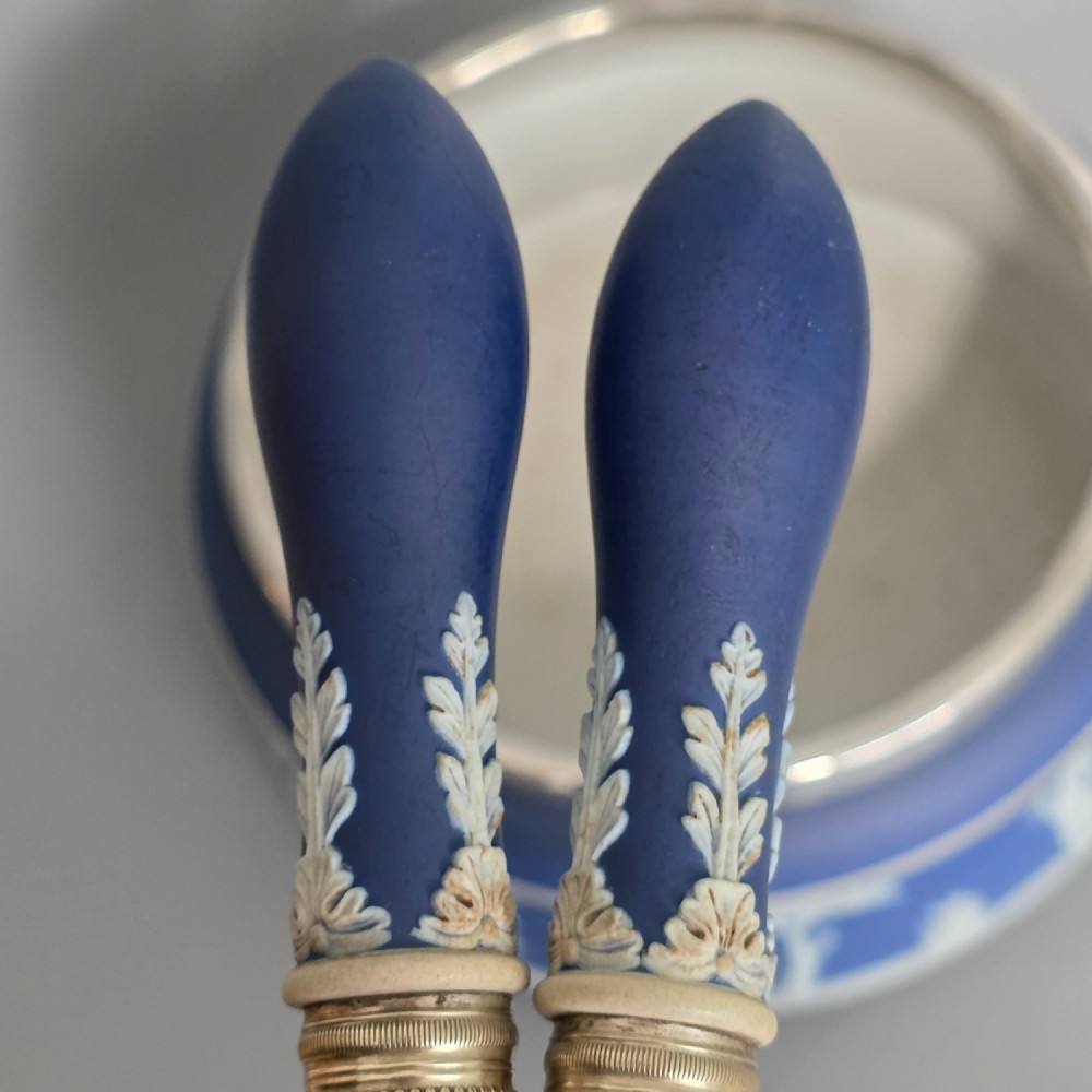 A Victorian Wedgwood blue jasperware salad bowl with a silver-plated rim, decorated with white neoclassical relief figures, complete with matching blue and silver servers. View X
