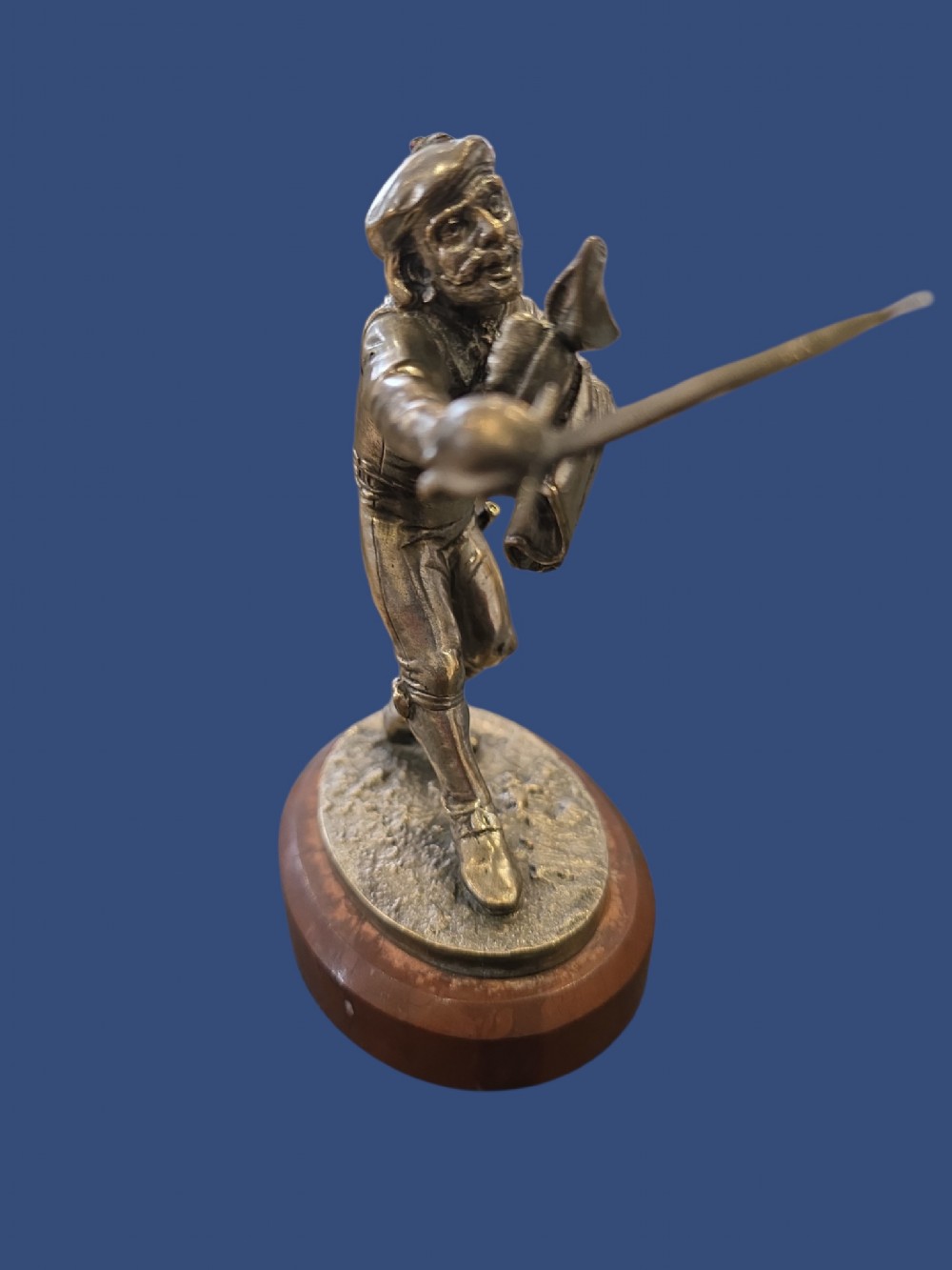 A nineteenth-century silvered bronze sculpture depicting a sword-wielding cavalier posed on an oval rouge marble plinth. View VII