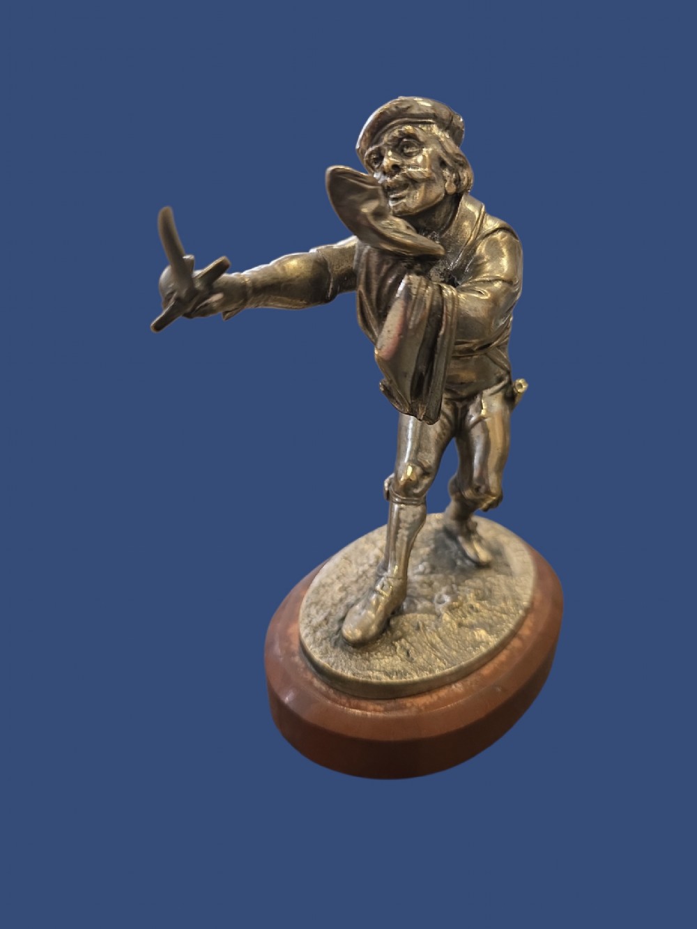 A nineteenth-century silvered bronze sculpture depicting a sword-wielding cavalier posed on an oval rouge marble plinth. View IX
