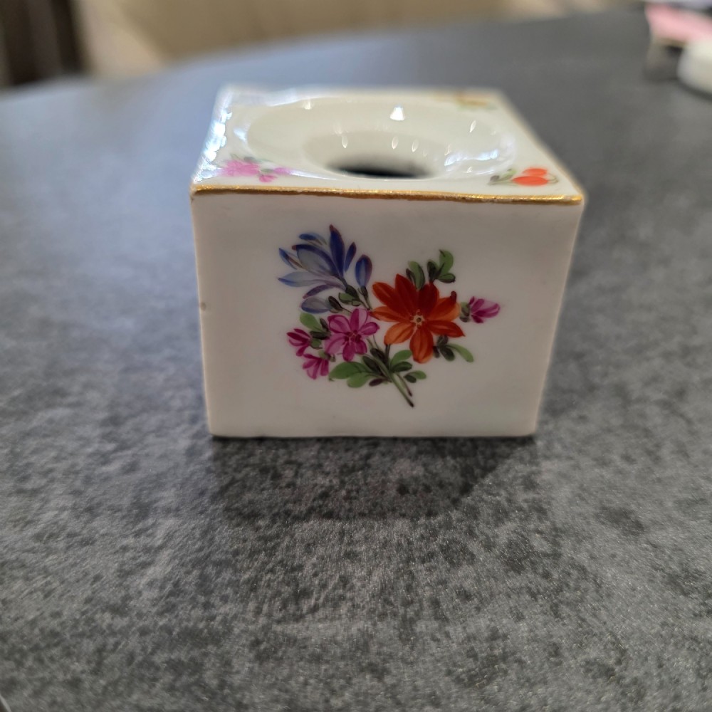 A square white porcelain inkwell featuring a recessed circular top, hand-painted botanical flowers on the sides, and a gold gilded rim. View II