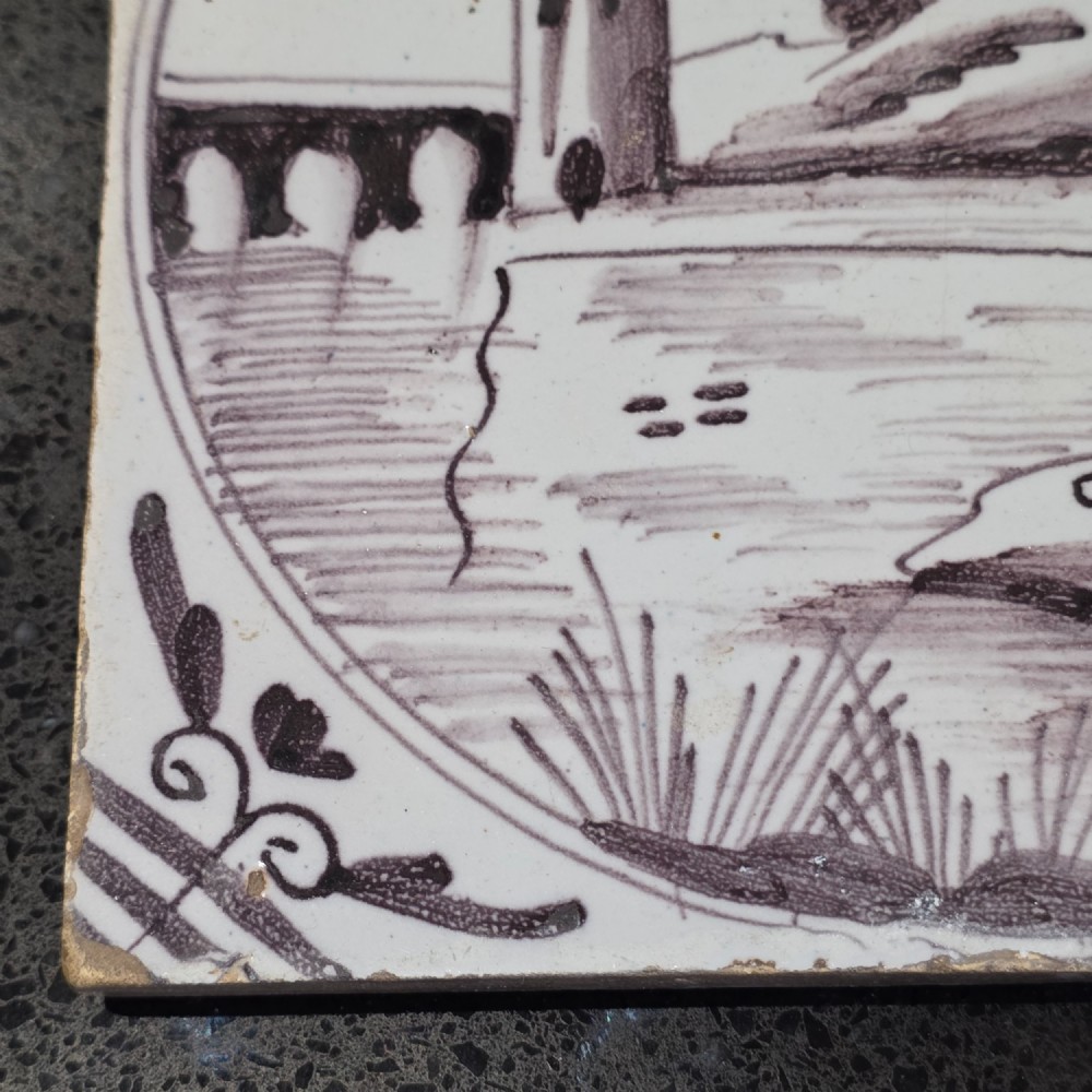 London delft tile painted in manganese with a man fishing in a river, circa 1725 - 1760 View II