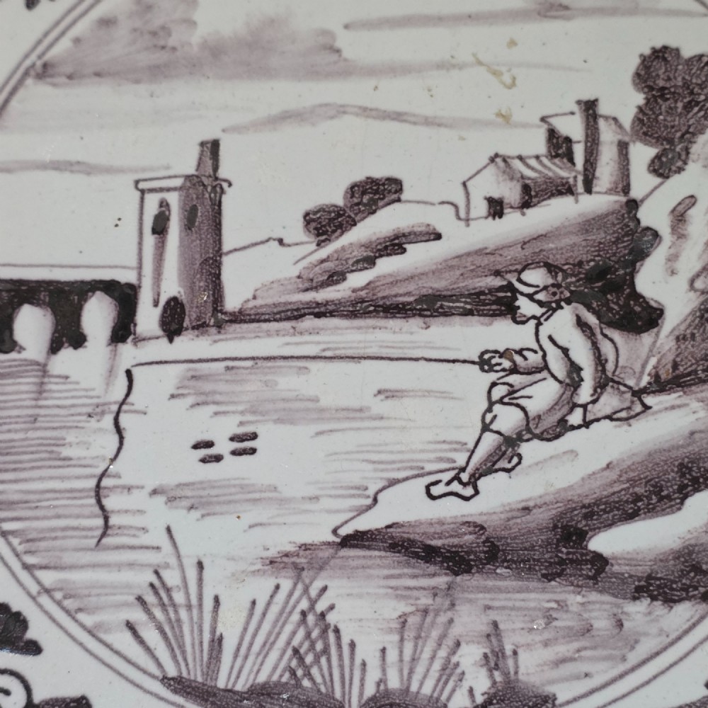 London delft tile painted in manganese with a man fishing in a river, circa 1725 - 1760 View VI