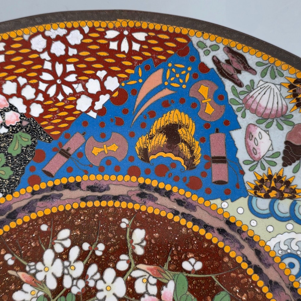 A circular Japanese cloisonne charger featuring a central medallion with birds and peonies on a brown aventurine background surrounded by patterned brocade sections. View VIII