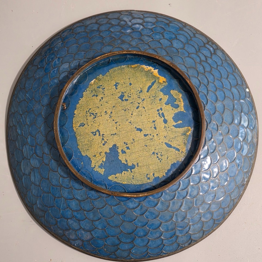 A circular Japanese cloisonne charger featuring a central medallion with birds and peonies on a brown aventurine background surrounded by patterned brocade sections. View X