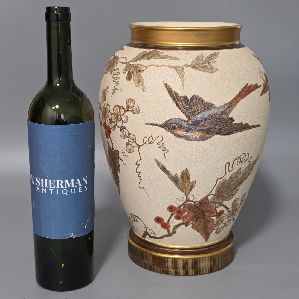 A large cream ceramic vase adorned with hand-painted botanical vines, foliage, berries, and gilded accents. View II