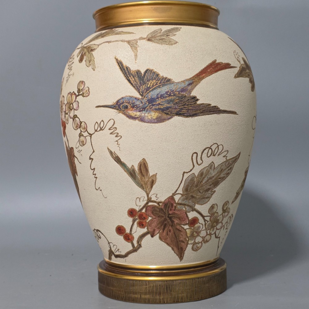 A large cream ceramic vase adorned with hand-painted botanical vines, foliage, berries, and gilded accents. View III