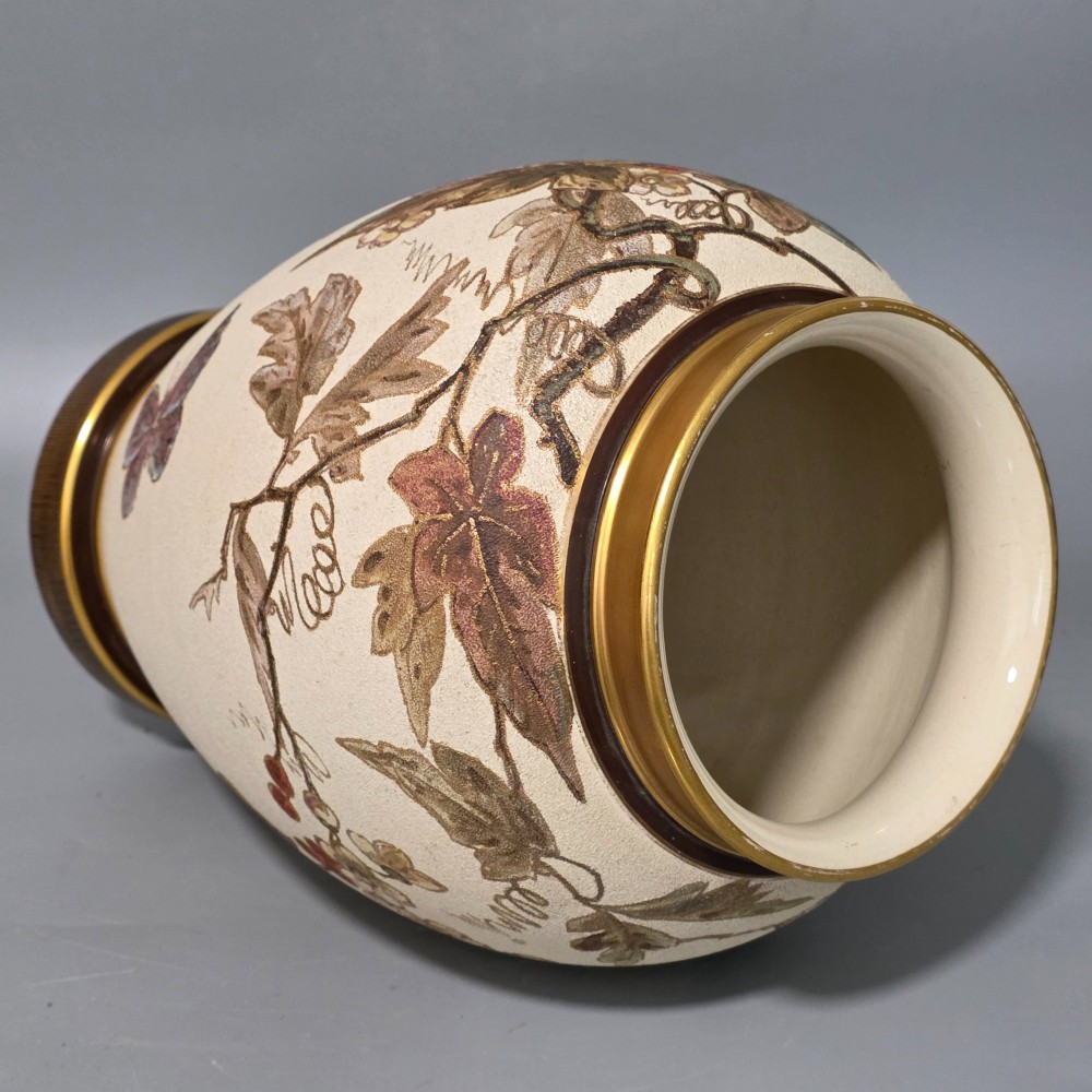 A large cream ceramic vase adorned with hand-painted botanical vines, foliage, berries, and gilded accents. View VIII