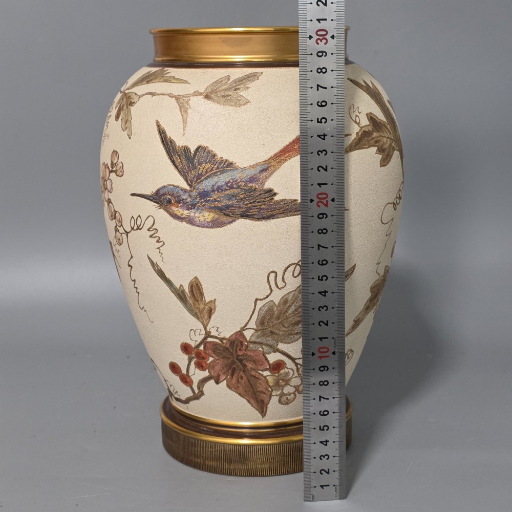 A large cream ceramic vase adorned with hand-painted botanical vines, foliage, berries, and gilded accents. View IX