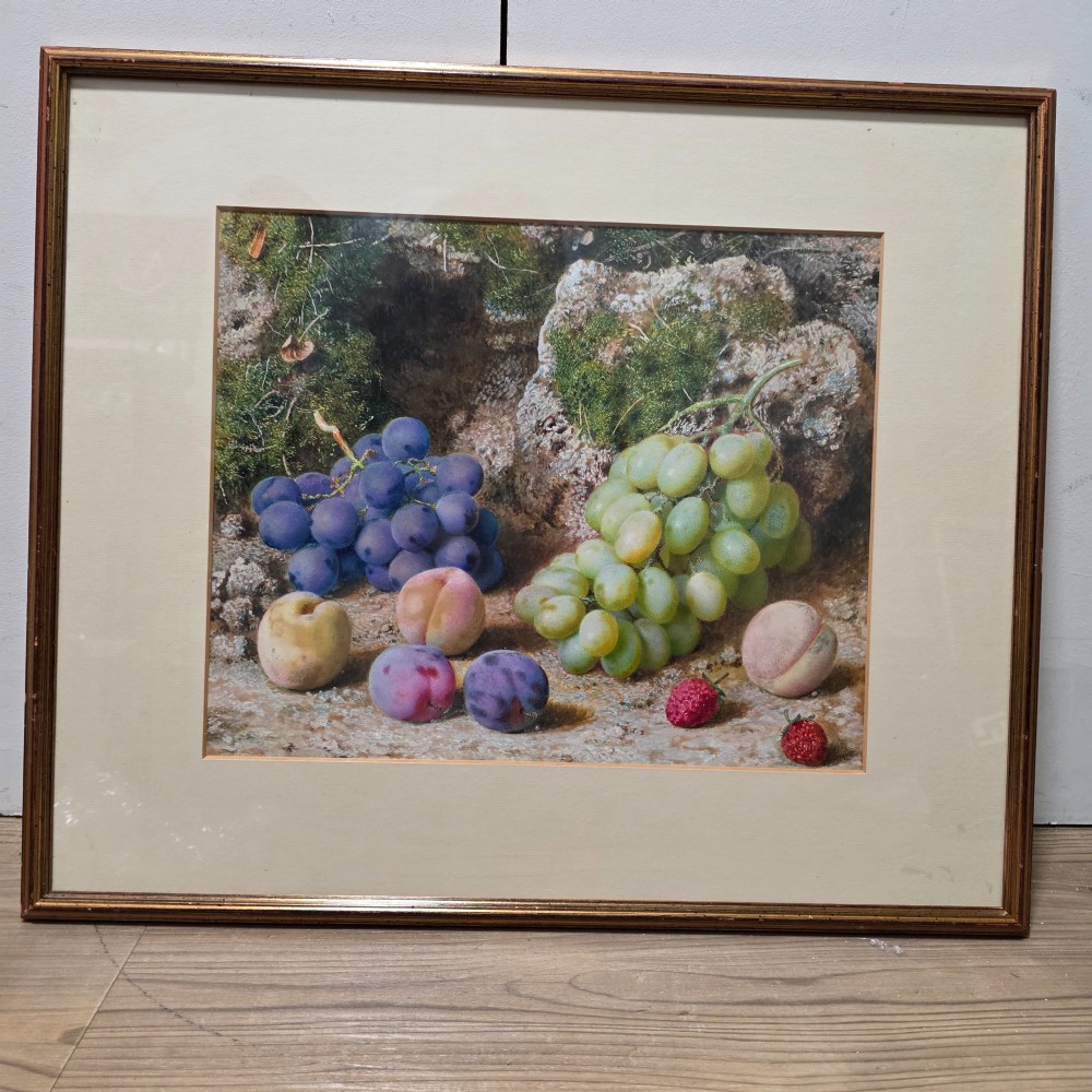 A framed 19th-century watercolour painting by John Sherrin depicting green and purple grapes, plums, and strawberries set against a mossy stone backdrop.
