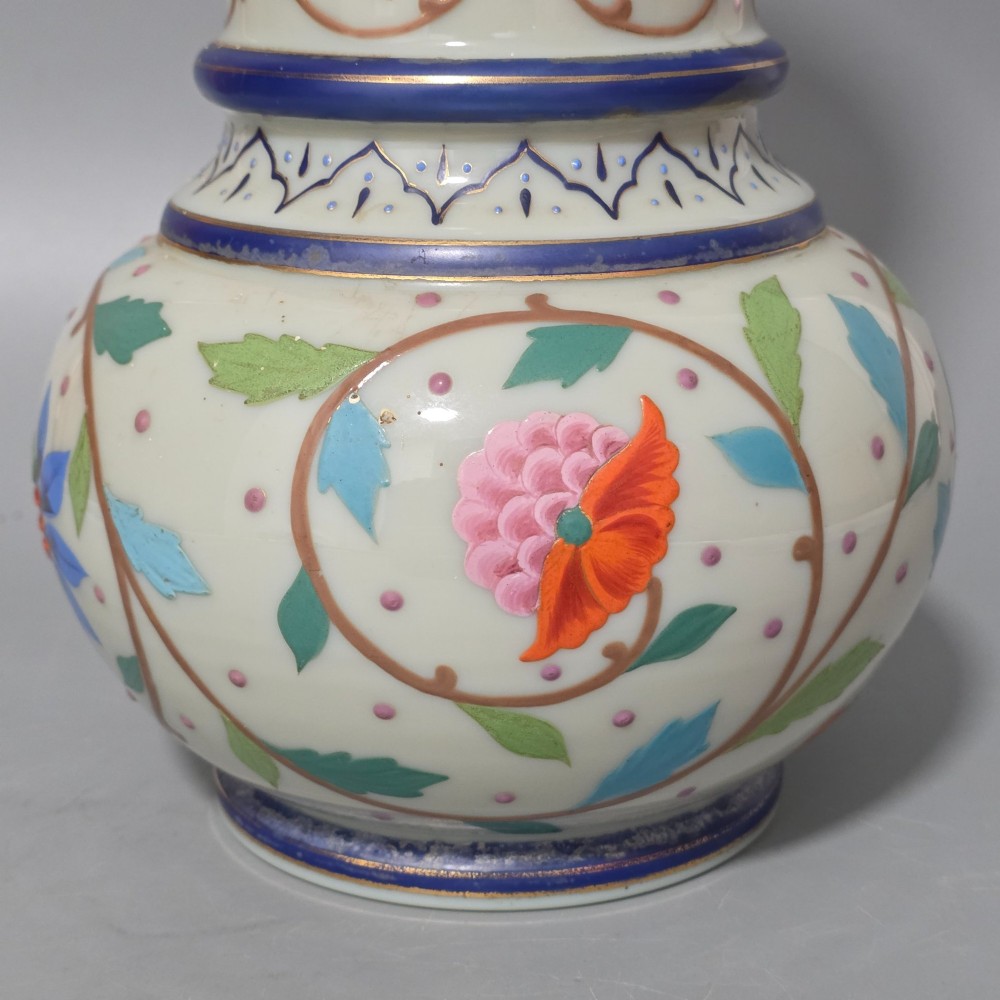An antique cream opaque glass vase featuring hand-painted floral arabesque enamel patterns in bright colours with gilded accents and cobalt blue bands. View VII